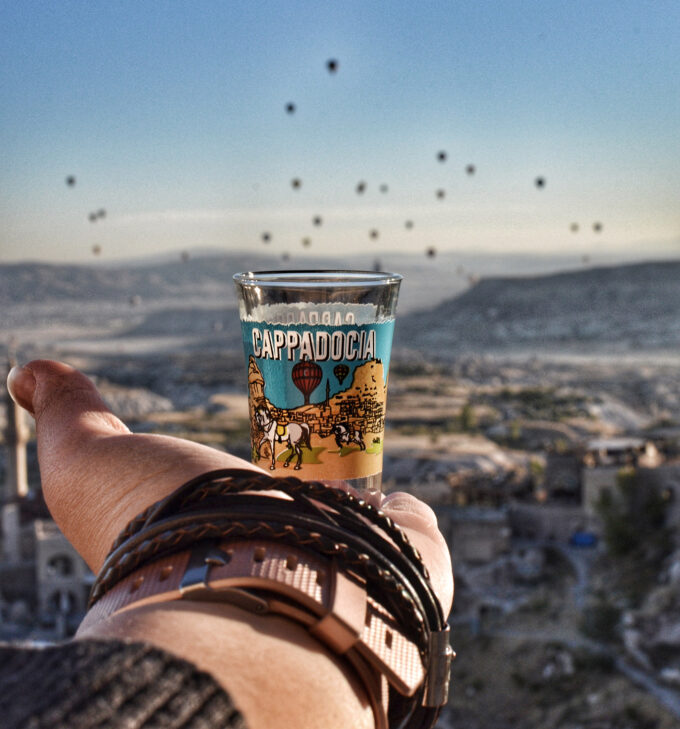 Catching sunrise in Uchisar and watching hot air balloons take off in Cappadocia.